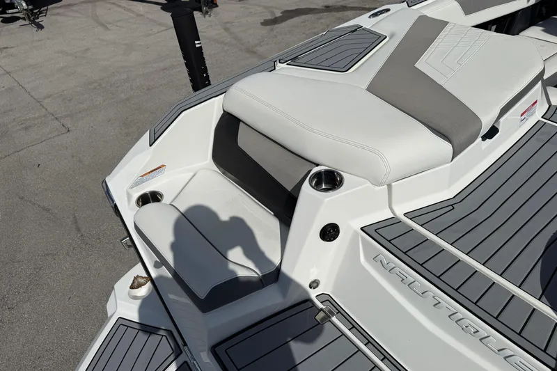  Yacht Photos Pics 2022 Nautique Super Air Nautique G23 boat interior with gray and white seating.
