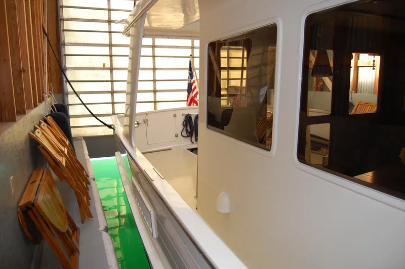 Legacy Yacht Photos Pics Ocean Alexander 50 Pilothouse 1981 in a boathouse.