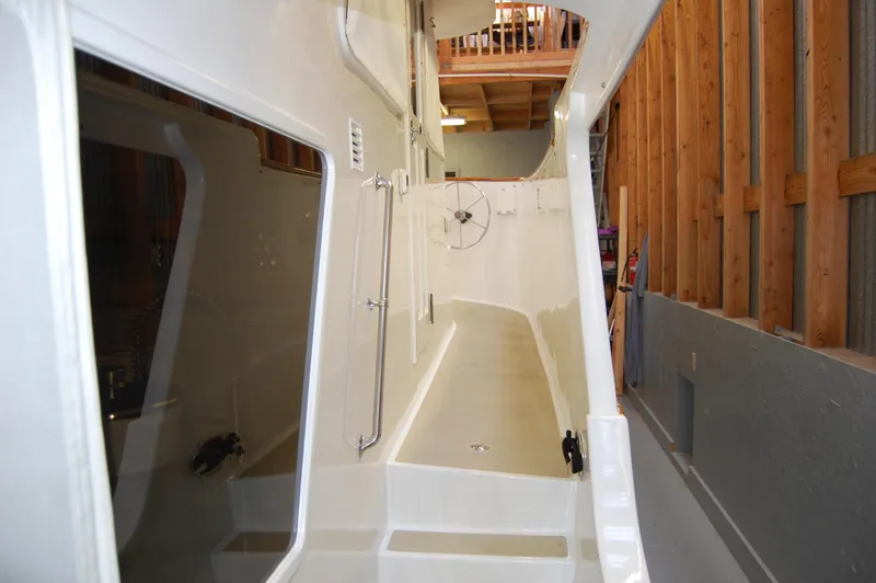 Legacy Yacht Photos Pics Side deck of 1981 Ocean Alexander 50 Pilothouse in a boatyard.