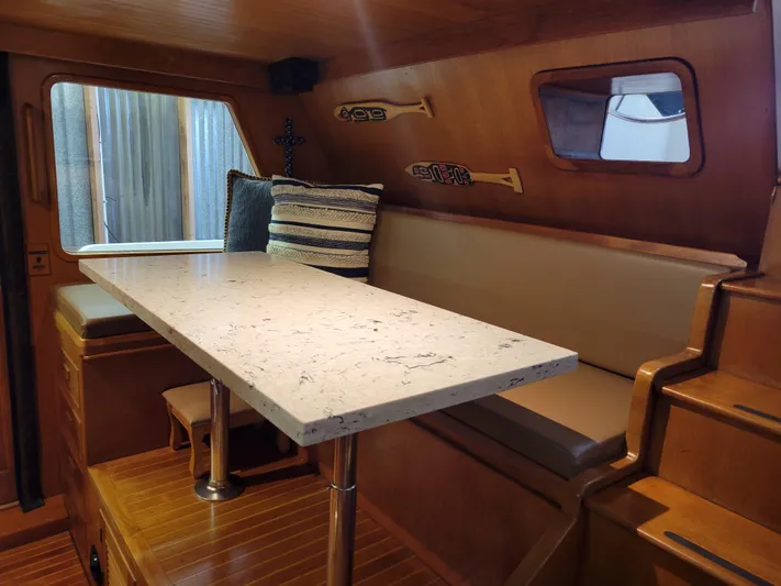 Legacy Yacht Photos Pics Interior of 1981 Ocean Alexander 50 Pilothouse yacht with dining table.