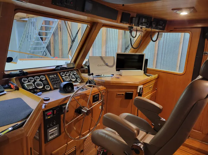 Legacy Yacht Photos Pics 1981 Ocean Alexander 50 Pilothouse interior with navigation equipment.