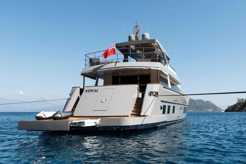  Yacht Photos Pics Luxury Heesen Pleasure Vessel, 1985 model, anchored in serene blue waters.