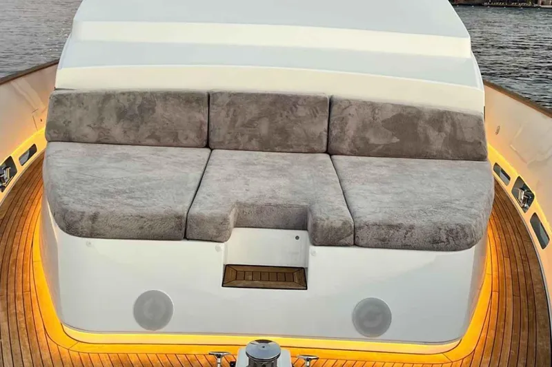  Yacht Photos Pics Luxurious seating area on 1985 Heesen Pleasure Vessel with ambient lighting and wooden deck.