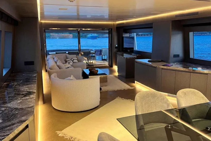  Yacht Photos Pics Luxurious interior of a 1985 Heesen Pleasure Vessel with modern furnishings and scenic water views.