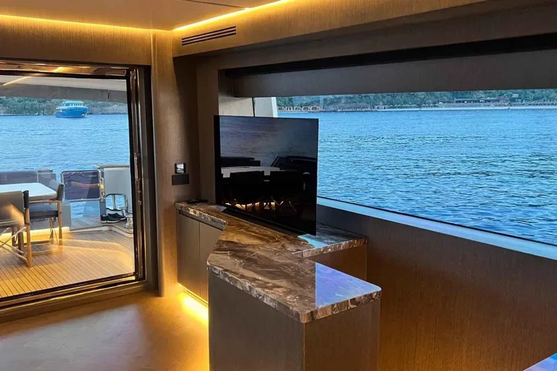  Yacht Photos Pics Luxurious interior of 1985 Heesen Pleasure Vessel with scenic water view and modern amenities.