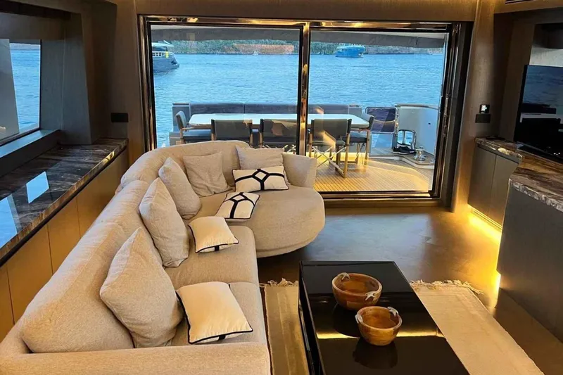  Yacht Photos Pics Luxurious interior of 1985 Heesen Pleasure Vessel with elegant seating and ocean view.