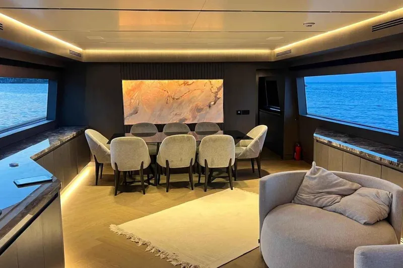  Yacht Photos Pics Luxurious interior of 1985 Heesen Pleasure Vessel with elegant dining area and ocean views.