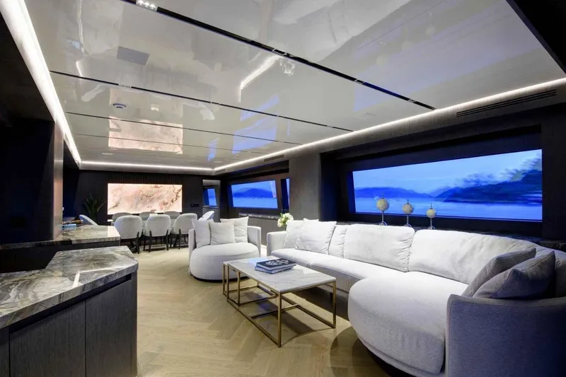  Yacht Photos Pics Luxurious interior of 1985 Heesen Pleasure Vessel with modern furnishings and scenic views.