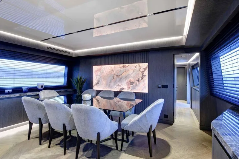  Yacht Photos Pics Luxurious dining area on 1985 Heesen Pleasure Vessel with modern decor and elegant lighting.