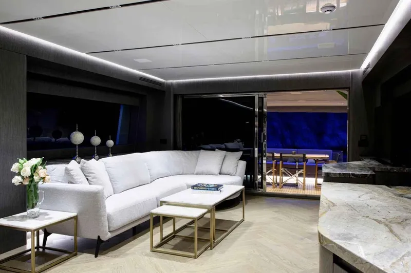  Yacht Photos Pics Luxurious interior of 1985 Heesen Pleasure Vessel with elegant seating and modern decor.