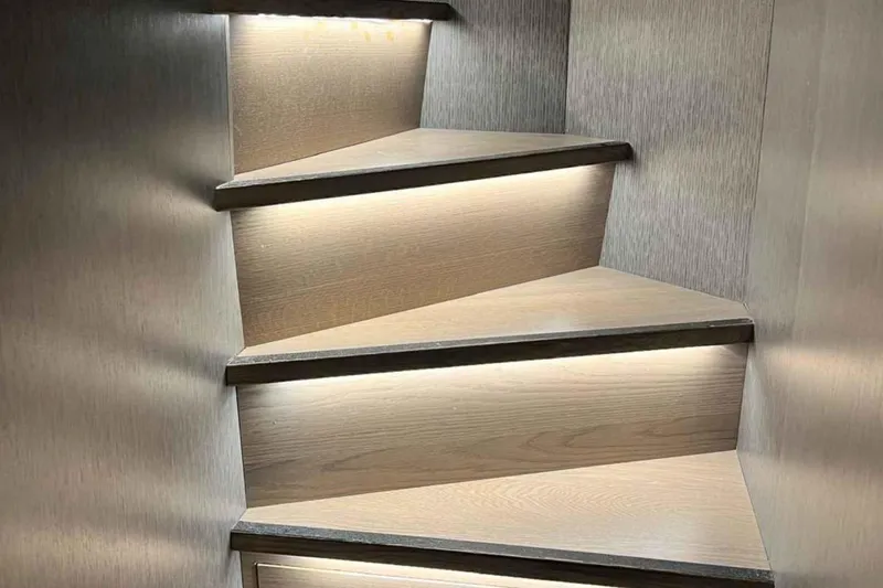  Yacht Photos Pics Illuminated wooden stairs inside a 1985 Heesen Pleasure Vessel.