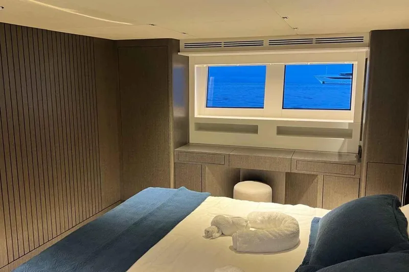  Yacht Photos Pics Luxurious bedroom interior of 1985 Heesen Pleasure Vessel with ocean view.