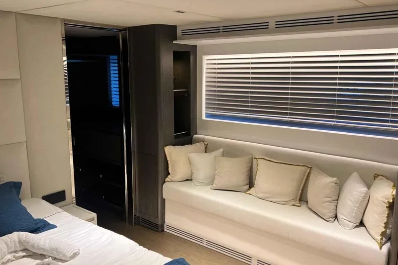  Yacht Photos Pics Luxurious interior of 1985 Heesen Pleasure Vessel with cozy seating and elegant decor.
