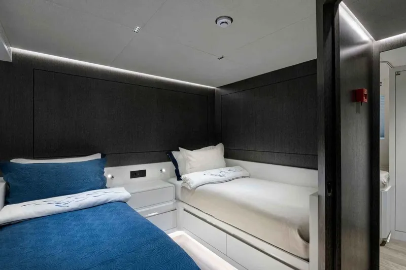  Yacht Photos Pics Luxurious cabin interior of 1985 Heesen Pleasure Vessel with twin beds and modern design.