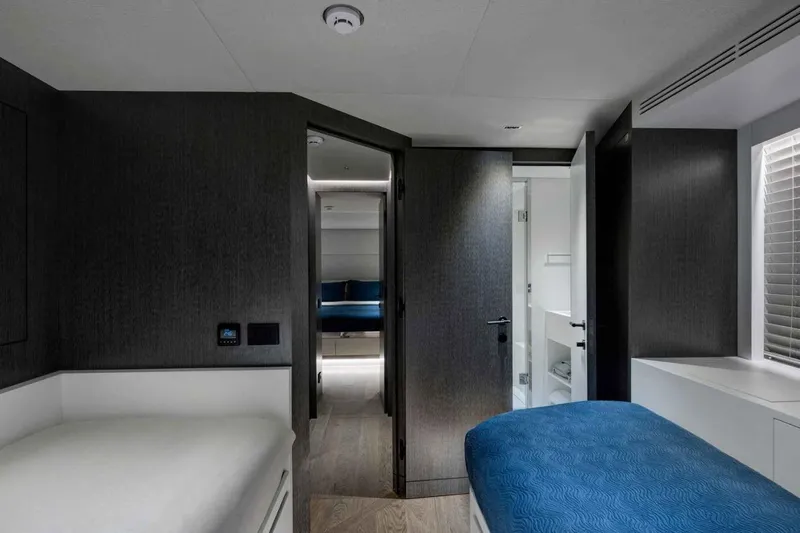  Yacht Photos Pics Luxurious 1985 Heesen Pleasure Vessel cabin interior with modern design and cozy bedding.