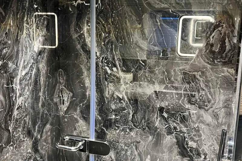  Yacht Photos Pics Luxurious marble interior of 1985 Heesen Pleasure Vessel, featuring sleek modern design.