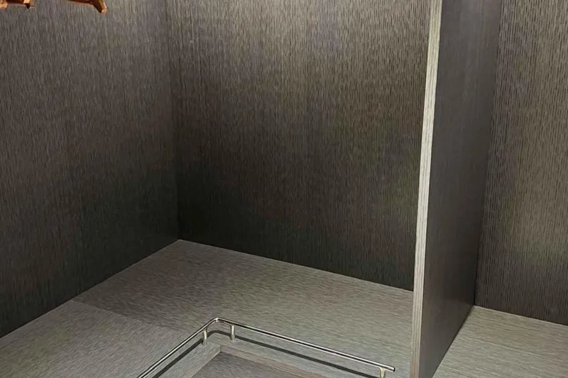  Yacht Photos Pics Interior of 1985 Heesen Pleasure Vessel with modern wood paneling and metal railing.