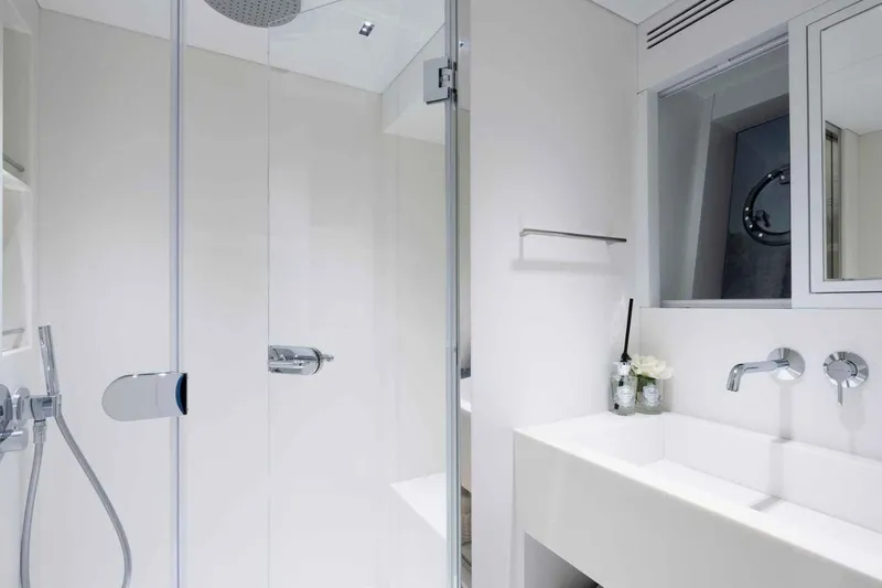  Yacht Photos Pics Luxurious bathroom on 1985 Heesen Pleasure Vessel with modern fixtures and sleek design.