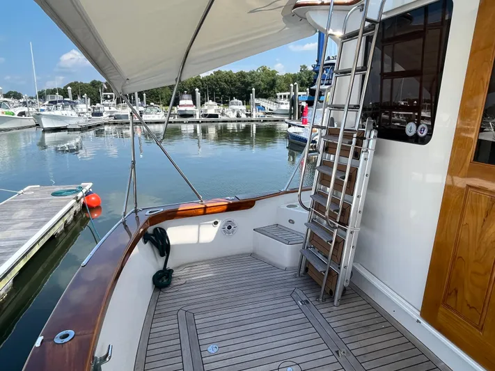 Angus III Yacht Photos Pics Alden 56 PHMY 1998 yacht deck with ladder, docked at marina.