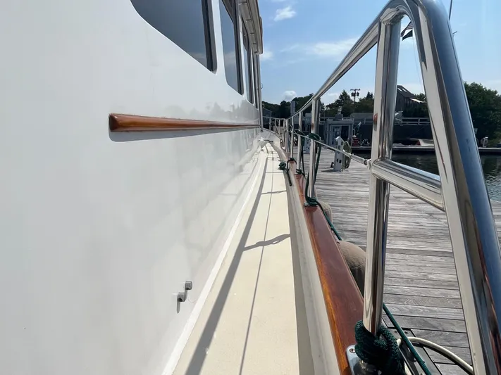 Angus III Yacht Photos Pics Alden 56 PHMY 1998 yacht side view with railing and dock.