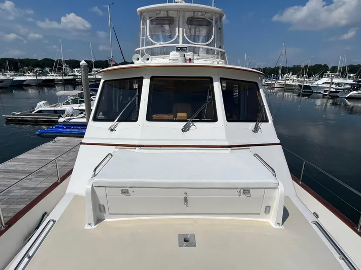 Angus III Yacht Photos Pics 1998 Alden 56 PHMY yacht docked at marina under clear blue sky.