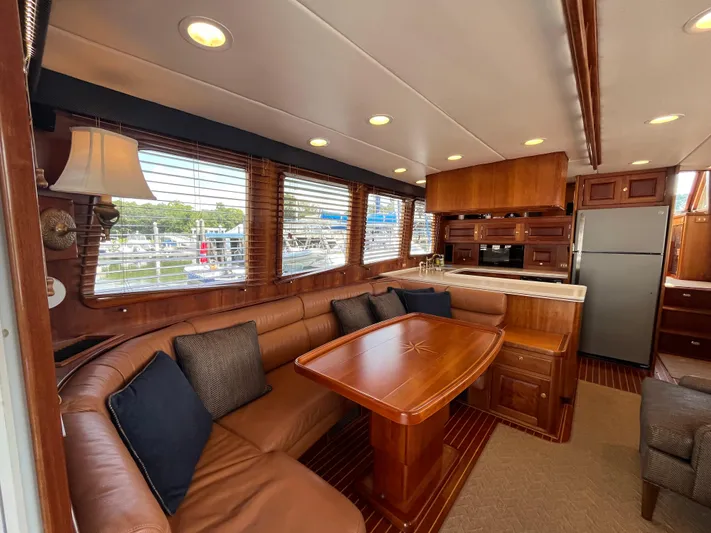 Angus III Yacht Photos Pics Luxurious interior of 1998 Alden 56 PHMY yacht with leather seating and wooden finishes.