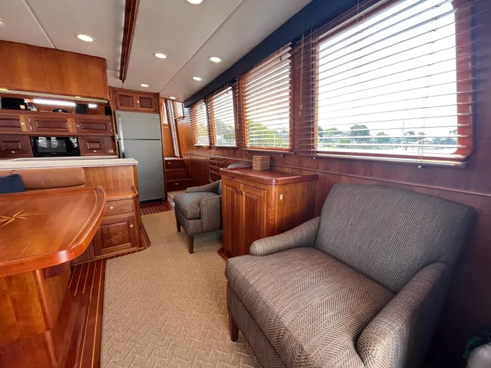 Angus III Yacht Photos Pics Luxurious interior of 1998 Alden 56 PHMY yacht with elegant wood finishes and comfortable seating.