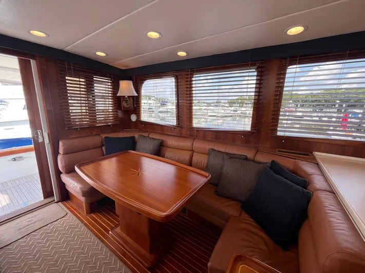 Angus III Yacht Photos Pics Luxurious interior of 1998 Alden 56 PHMY yacht with elegant wood finishes and comfortable seating.