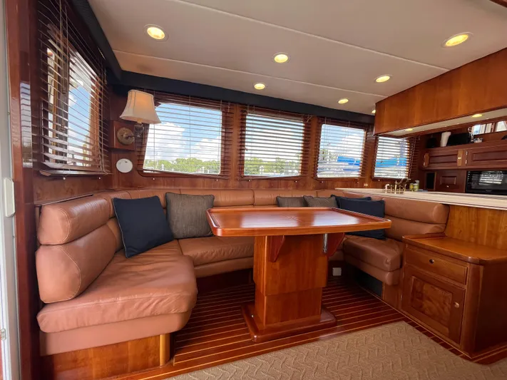 Angus III Yacht Photos Pics Luxurious interior of 1998 Alden 56 PHMY yacht with leather seating and wooden finishes.