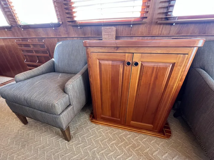 Angus III Yacht Photos Pics Wooden cabinet and upholstered chair in Alden 56 PHMY yacht interior, 1998 model.