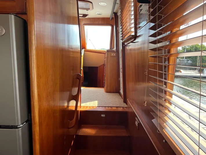 Angus III Yacht Photos Pics Interior view of 1998 Alden 56 PHMY yacht with wooden finishes and natural light.
