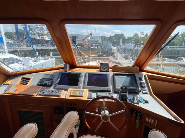 Angus III Yacht Photos Pics 1998 Alden 56 PHMY yacht helm with navigation equipment and steering wheel.