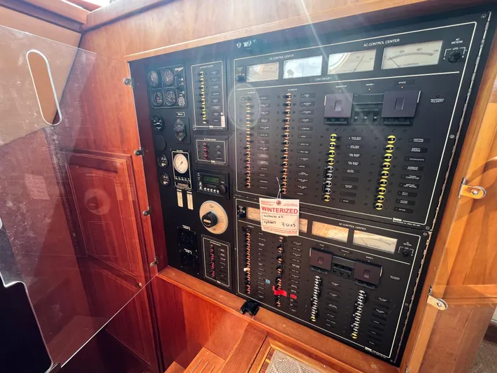 Angus III Yacht Photos Pics Control panel of a 1998 Alden 56 PHMY yacht, featuring gauges and switches.