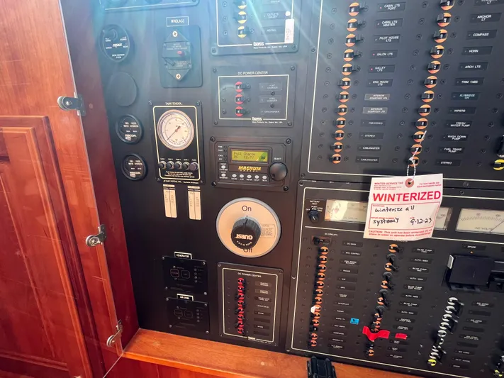 Angus III Yacht Photos Pics Control panel of a 1998 Alden 56 PHMY yacht, featuring gauges and switches.