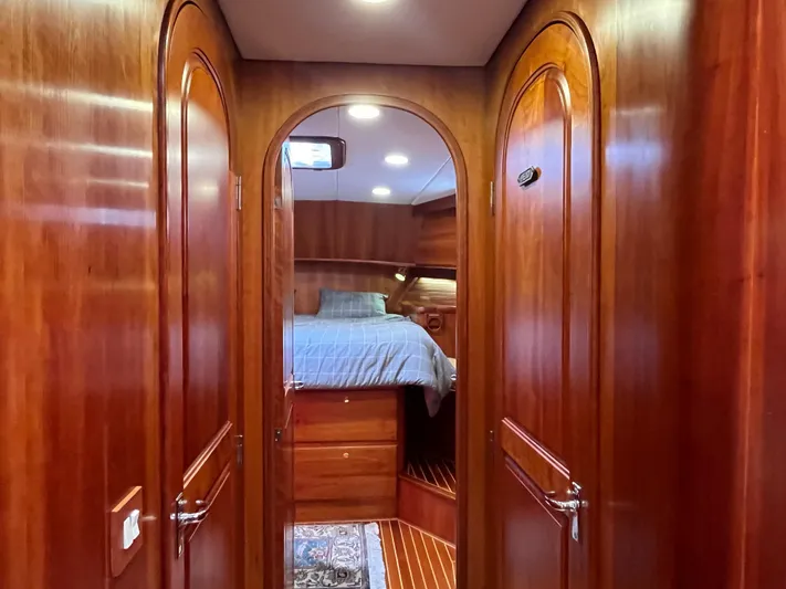 Angus III Yacht Photos Pics Luxurious wooden interior of 1998 Alden 56 PHMY yacht cabin with cozy bed.