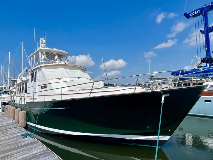 Angus III Yacht Photos Pics Alden 56 PHMY 1998 yacht docked at marina under clear blue sky.