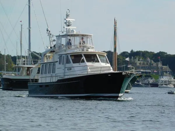 Angus III Yacht Photos Pics Alden 56 PHMY yacht from 1998 cruising in a scenic harbor setting.