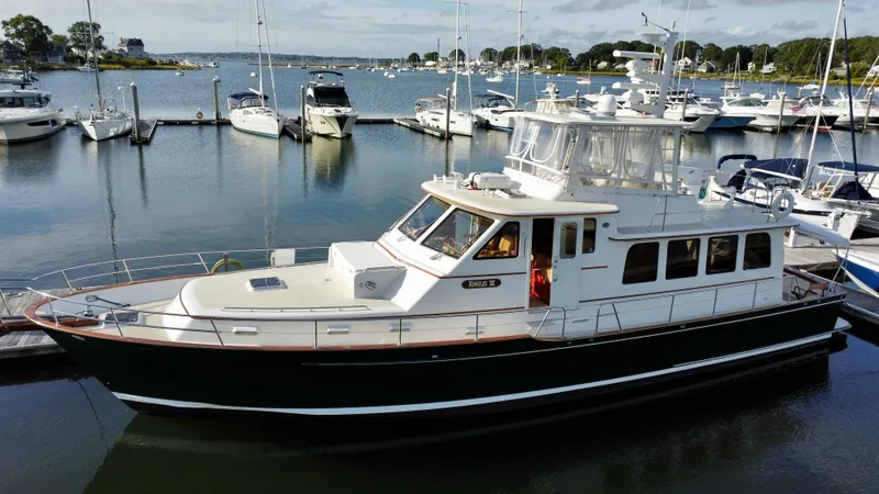 Angus III Yacht Photos Pics Alden 56 PHMY 1998 yacht docked in a marina, surrounded by other boats.