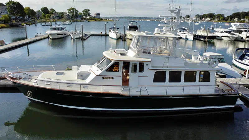 Angus III Yacht Photos Pics Alden 56 PHMY 1998 yacht docked in a marina, surrounded by other boats.