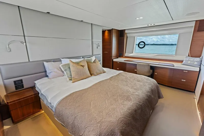 3bboys Yacht Photos Pics Luxurious bedroom interior of 2018 Princess Y75 yacht with elegant decor and ocean view.