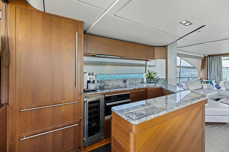 3bboys Yacht Photos Pics Luxurious 2018 Princess Y75 yacht interior with modern kitchen and ocean view.