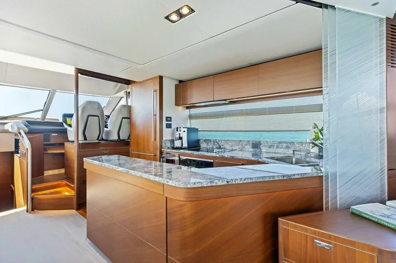 3bboys Yacht Photos Pics Luxurious interior of 2018 Princess Y75 yacht with modern kitchen and helm station.