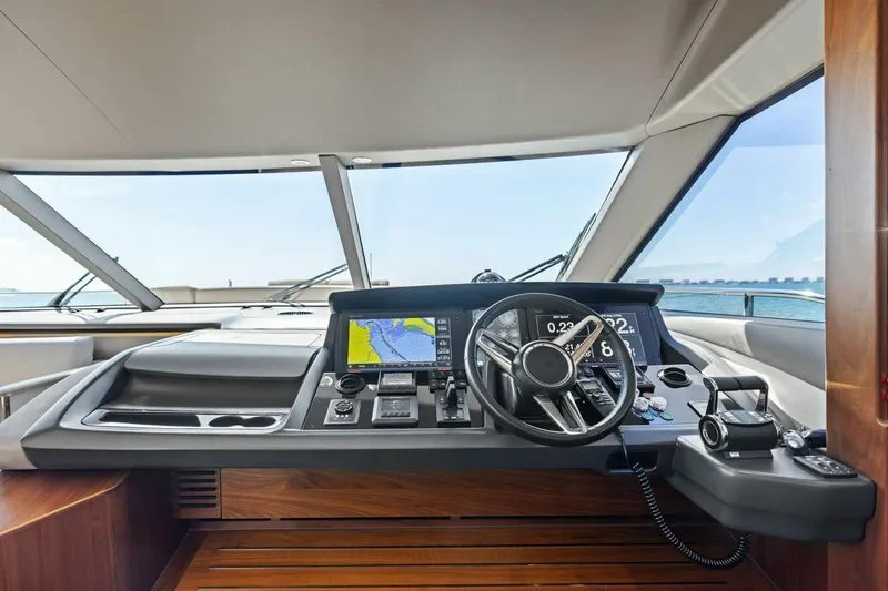 3bboys Yacht Photos Pics Cockpit of 2018 Princess Y75 yacht with navigation controls and sea view.