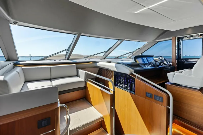 3bboys Yacht Photos Pics Luxurious interior of 2018 Princess Y75 yacht with modern helm and seating area.