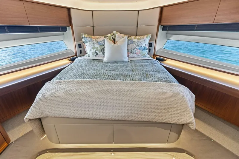 3bboys Yacht Photos Pics Luxurious bedroom interior of 2018 Princess Y75 yacht with ocean view windows.