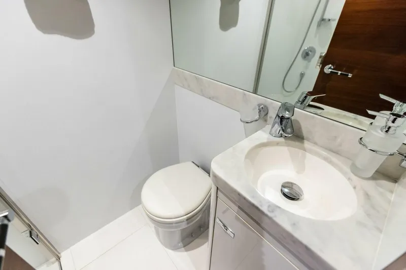 3bboys Yacht Photos Pics Luxurious bathroom in 2018 Princess Y75 yacht with modern fixtures and elegant design.