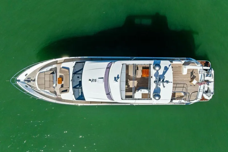 3bboys Yacht Photos Pics Aerial view of 2018 Princess Y75 yacht on green water.