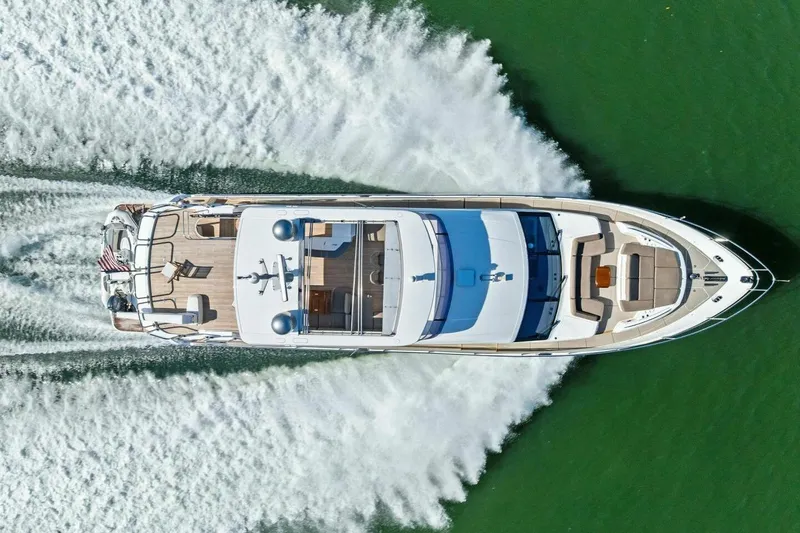 3bboys Yacht Photos Pics Aerial view of 2018 Princess Y75 yacht cruising on green water.