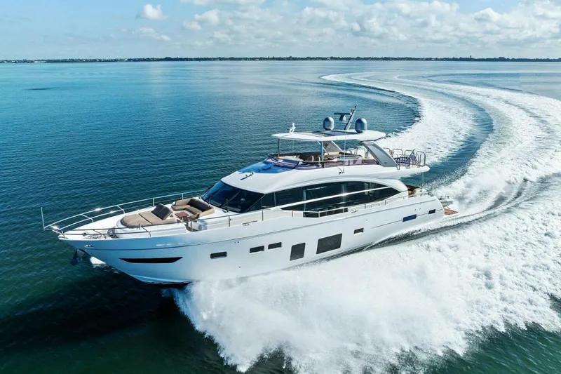3bboys Yacht Photos Pics Luxurious 2018 Princess Y75 yacht cruising on open water, creating elegant waves.
