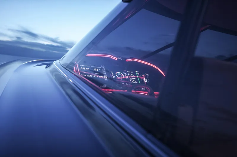  Yacht Photos Pics Futuristic dashboard of 2026 Cantieri di Pisa 80 Fast yacht at dusk.